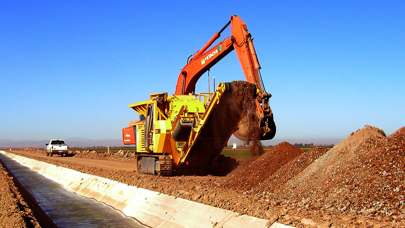 Crushing concrete along a canal in Southern California